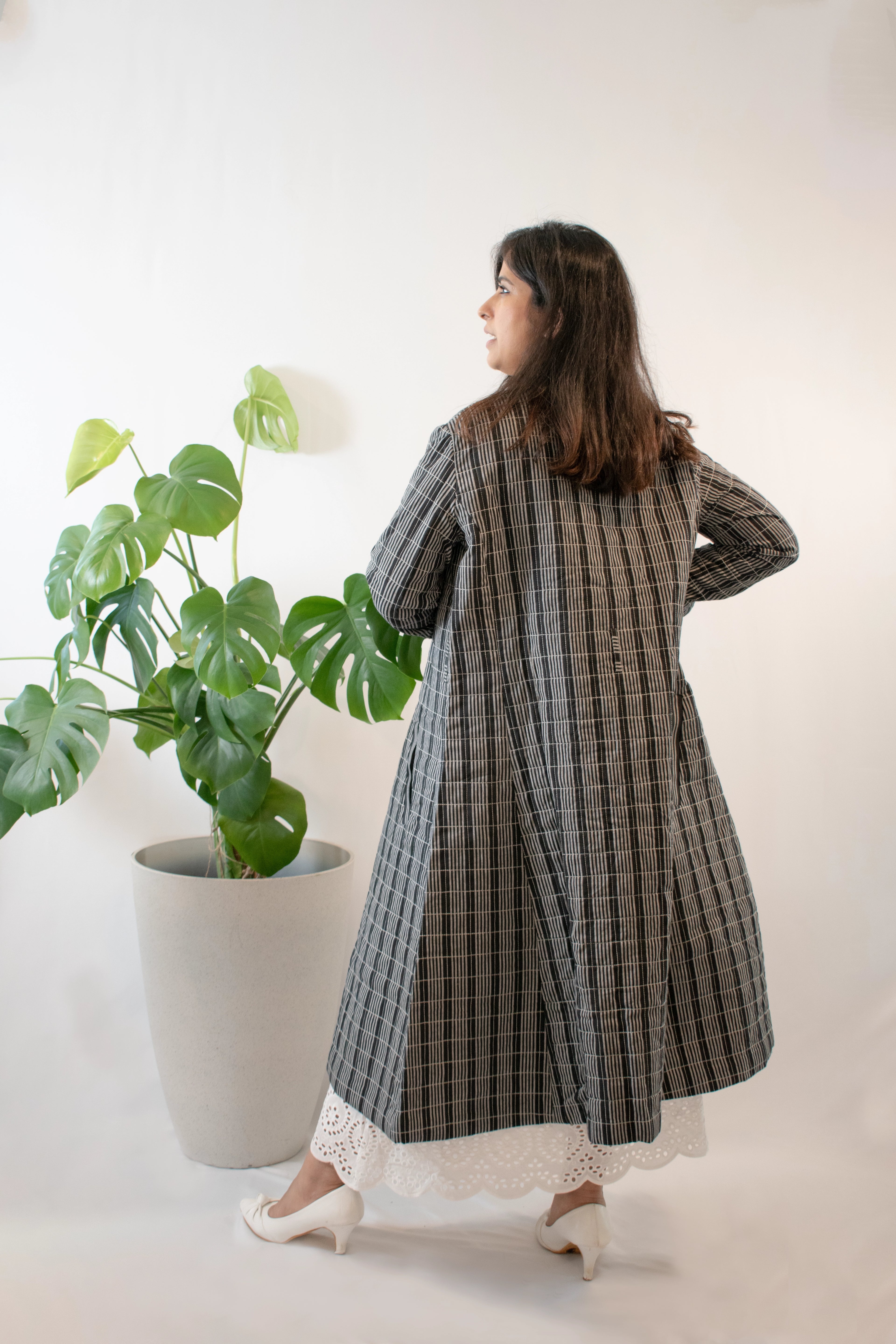 Black and white long quilted jacket back view