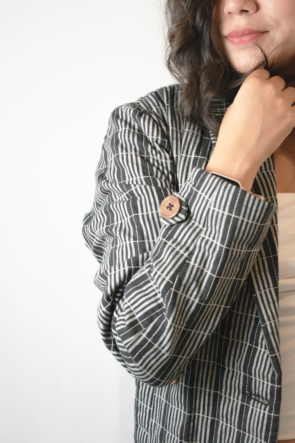 Black and white long quilted jacket close look