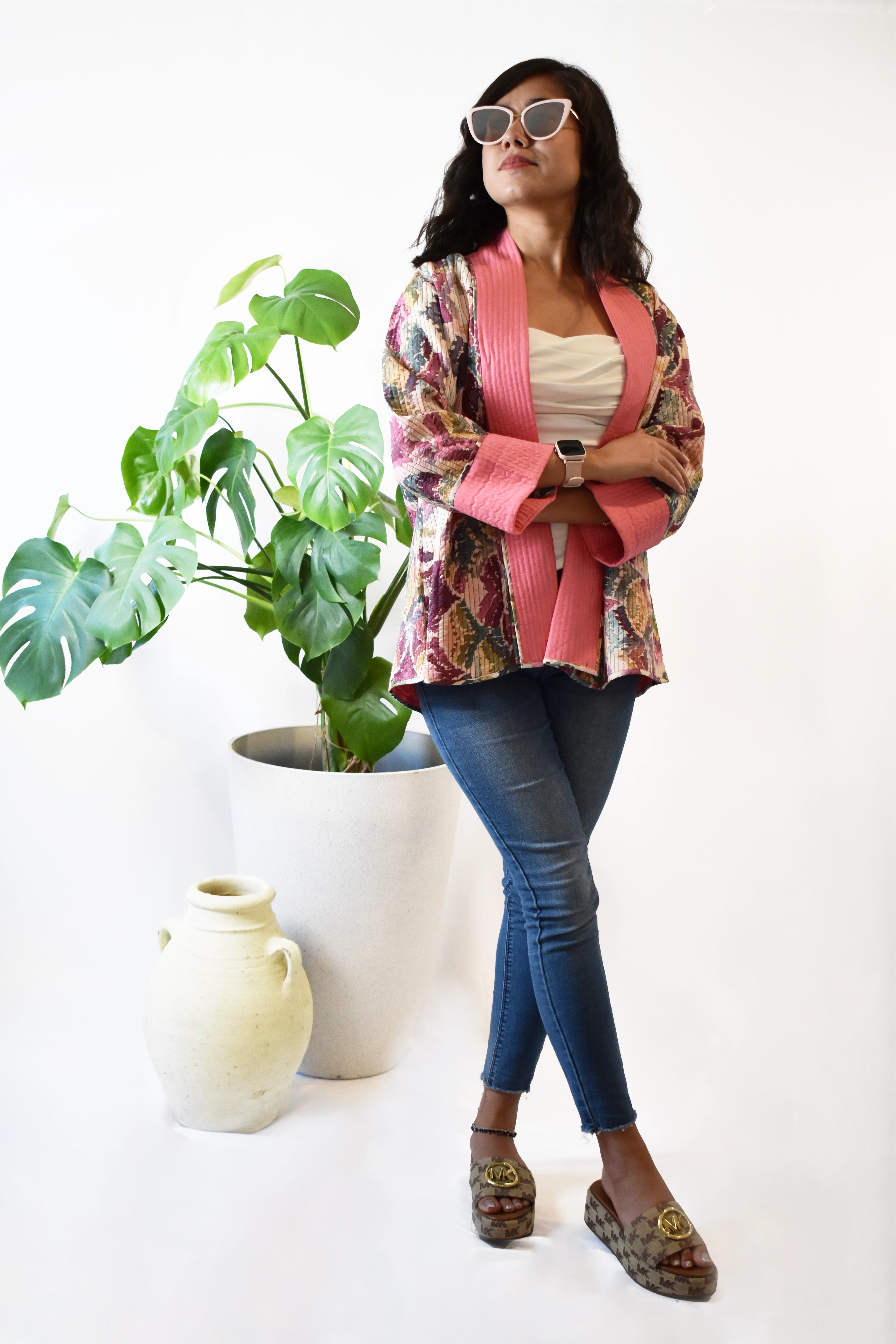 Woman wearing a colorful pink quilted short jacket